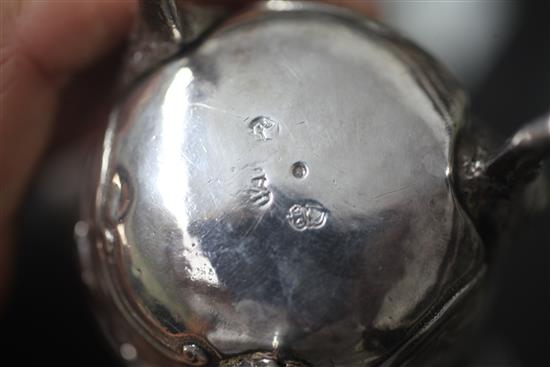 A mid 18th century Irish silver tripod milk jug, by William Townsend? 6 0z.